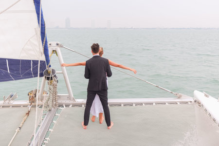 Portrait caucasian couple in love romance on luxury white yacht in ocean
