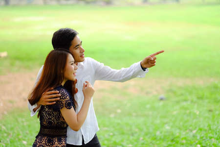 Portrait asian young couple in love, boyfriend and girlfriend happy in parkの写真素材