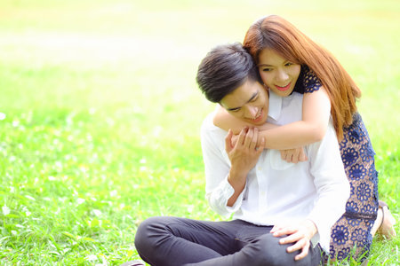 Portrait asian young couple in love, boyfriend and girlfriend happy in park