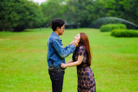 Portrait asian young couple in love, boyfriend and girlfriend happy in park