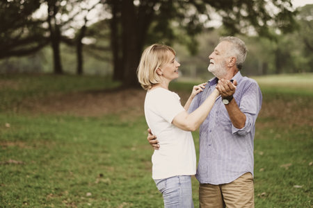 Portrait caucasian senior woman and old man, couple elder in love happy in the park