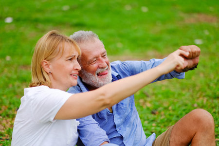 Portrait caucasian senior woman and old man, couple elder in love happy in the park