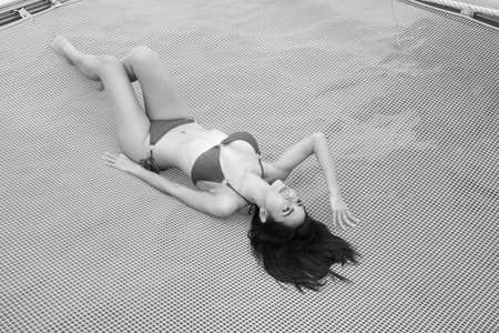portrait sexy asian woman wear bikini on the yachtの写真素材