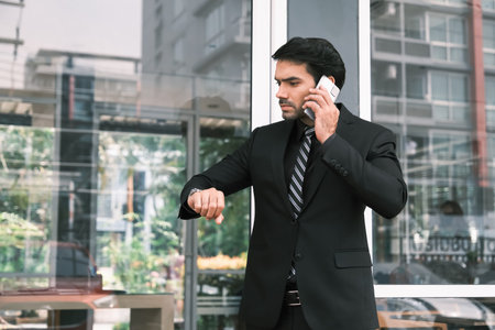 Caucasian handsome business man waiting some people or partner or customer or friend in outside