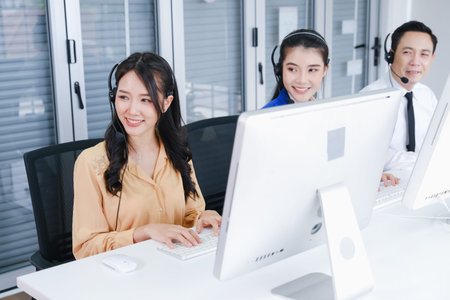 team call center operator with headset in office or workplace