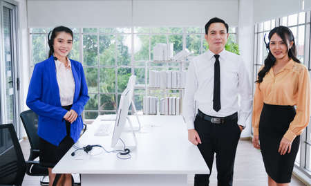 team call center operator with headset in office or workplaceの写真素材