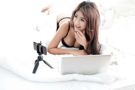 Portrait sexy asian woman wear lingerie or underwear, sexy live web camera online conceptの写真素材
