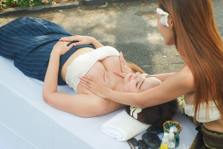 Two asian sexy women doing spa massage together in outdoorの写真素材