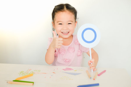 happy family asian drawing together in houseの写真素材