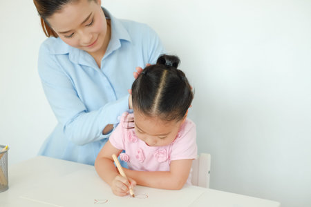 happy family asian drawing together in house