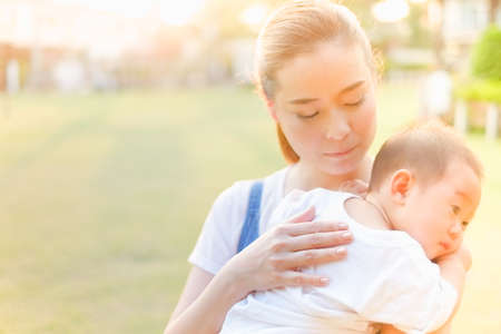 Happy asian family in the Parkの写真素材