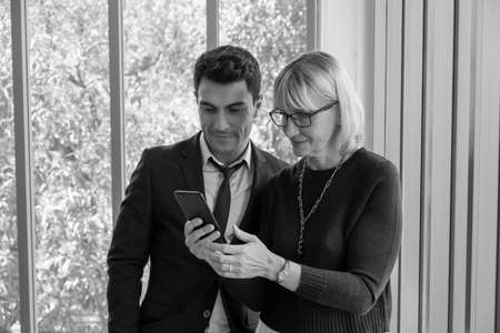 businessman and businesswoman meeting in office roomの写真素材