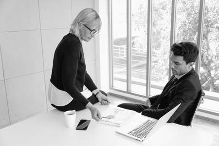 businessman and businesswoman meeting in office roomの写真素材
