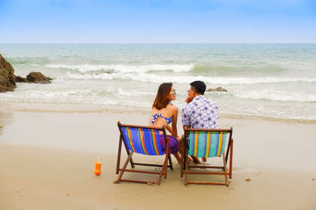 Portrait asian couple in love, sexy bikini on the beach, happy life on summer seasonの写真素材