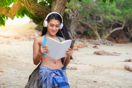 sexy asian woman wearing bikini on the beachの写真素材