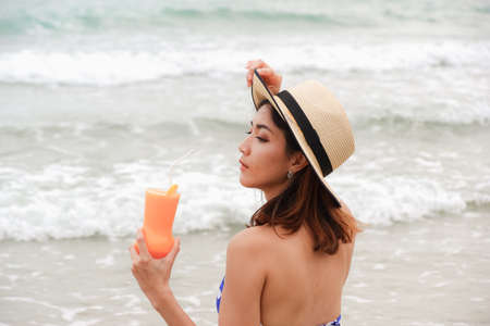 sexy asian woman wearing bikini on the beachの写真素材