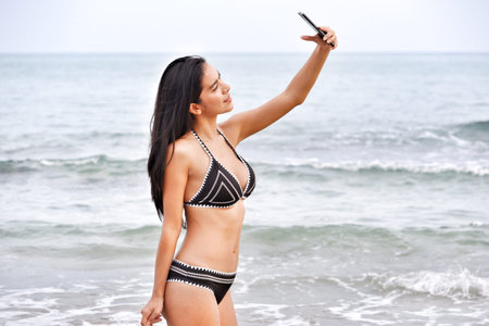 sexy asian woman wearing bikini on the beachの写真素材