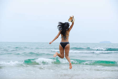 sexy asian woman wearing bikini on the beachの写真素材