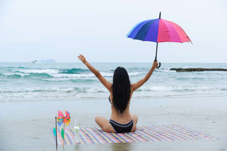sexy asian woman wearing bikini on the beachの写真素材
