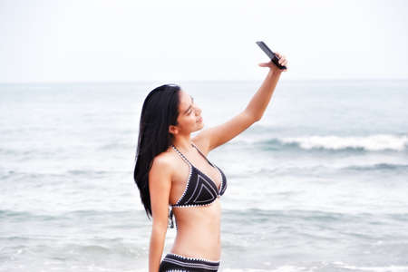 sexy asian woman wearing bikini on the beachの写真素材