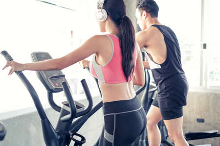 asian group friends working out or exercise and wearing sportswear in fitness or gym center, strength sporty and weight loss conceptの写真素材