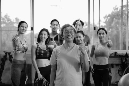 asian Senior man and young group people, Friends different ages in gym working outの写真素材