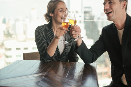 Two businessman and businesswoman couple meeting in co working space at sky lounge or office