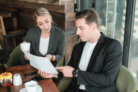 Two businessman and businesswoman couple meeting in co working space at sky lounge or office