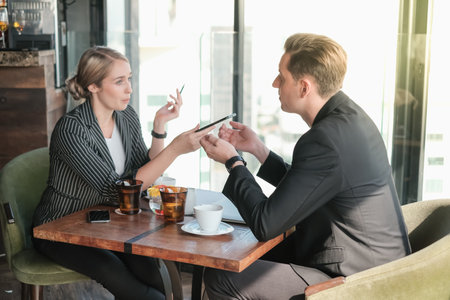 Two businessman and businesswoman couple meeting in co working space at sky lounge or officeの写真素材