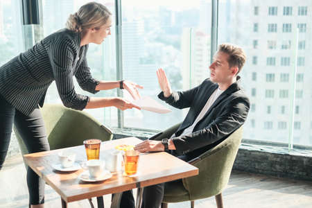 Two businessman and businesswoman couple meeting in co working space at sky lounge or officeの写真素材
