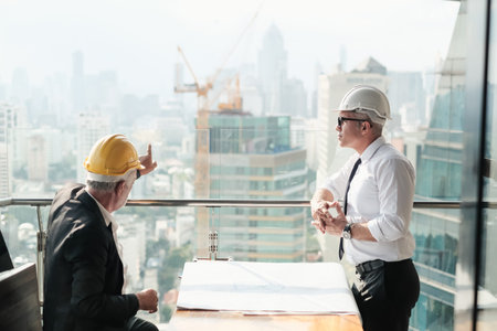 professional old architect and Senior foreman are talking the project job
