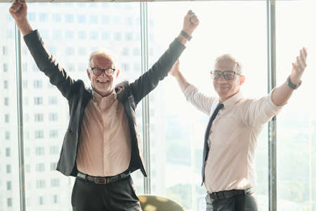 Two Senior businessman couple meeting in co working space at skyscraper lounge or officeの写真素材