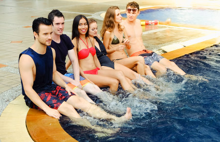 Portrait sexy bikini poolside party enjoy meeting group friends having fun in swimming pool, happy...