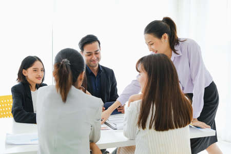 Asian business in seminar or employees group meeting in a conference roomの写真素材