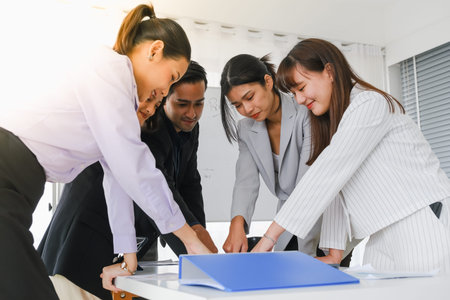 Asian business in seminar or employees group meeting in a conference room