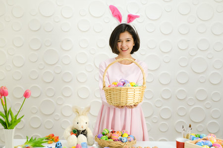 Portrait beautiful young asian girl with painted eggs, Happy easter day