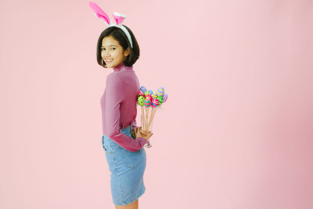Portrait beautiful young asian girl with painted eggs, Happy easter day