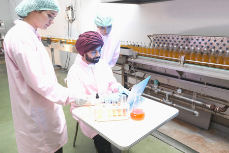 South asia factory worker laboratory assistant or team expert quality staff is test liquid in lab