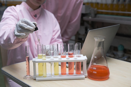 South asia female laboratory assistant or woman expert quality staff is test liquid in factory or labの写真素材