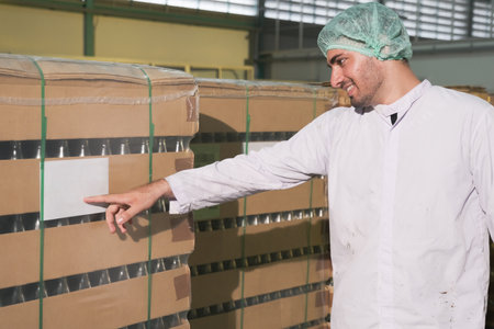south Asia man factory worker or expert staff is checking stock in storeの写真素材