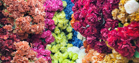 fake many flower in the wall backgroundの写真素材