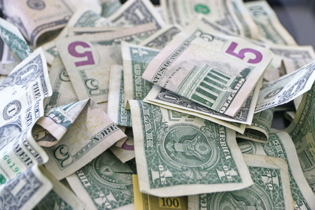 Pile of America dollar bills in donation box.の写真素材