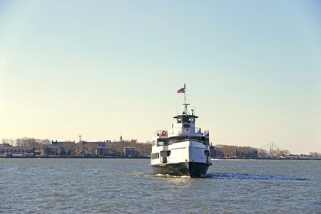 Newyork city Newyork  MARCH 21: Transportation Ship sailing away from Ellis Island in the morning at Newyork bay Newyork on March 212014.のeditorial素材
