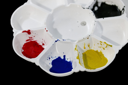 Art palette and water color isolated on black backgroundの写真素材
