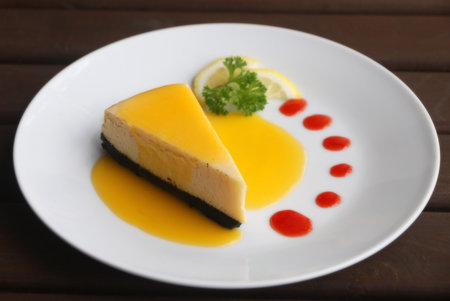 Piece of lemon cheesecake serve with lemon syrup