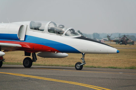 Military airplane parked on the airport waiting for the permission to fly.