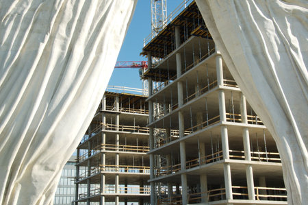 Construction behind stone curtain