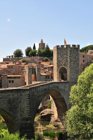 An early-Medieval fortified masonry bridge crossing the river into the town of Besalu.の写真素材