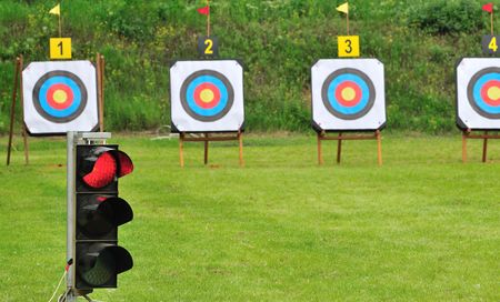 Red lamp (shoot is forbidden) and archery targets with bullseye for competition.の写真素材
