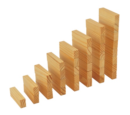 Business statistics graph. Wooden columns isolated on white.の写真素材